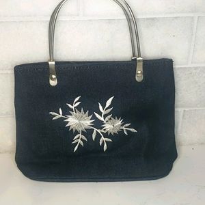 Denim purse embroidered white flowers lined silver handle  unknown maker